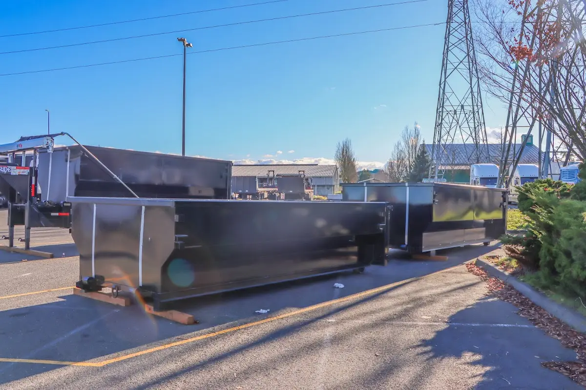 Roll-off dumpster ready for waste disposal at job site for Concrete Dumpster Rental in Woodruff